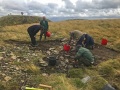 Archaeological investigation on Twmbarlwm, Risca, south Wales. performed by Clwyd Powys Archaeological Trust; organised by Cymdeithas Twmbarlwm Society, Funded by Cadw